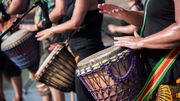 Drummers' hands playing African Drums